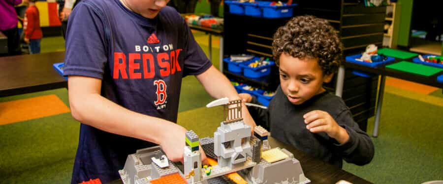 Two children play with Legos