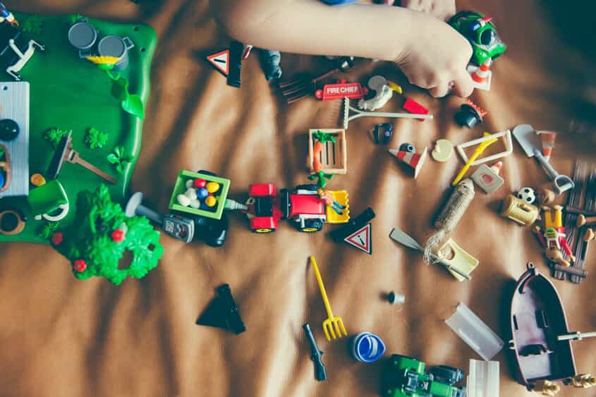 a child plays with building toys