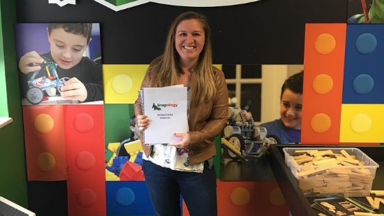 Kayla Opperman holds a snapology operation manual