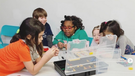 Children make parade floats in a Snapology class at Okabaloo