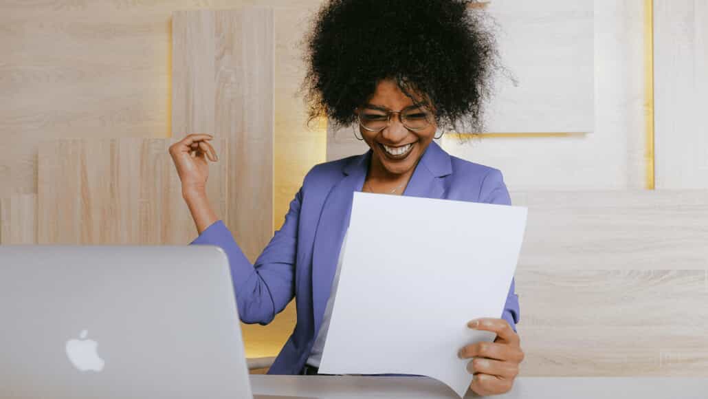 Smiling lady looking at paperwork